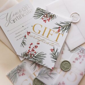Stylish arrangement of holiday-themed gift certificates with envelopes and wax seals.